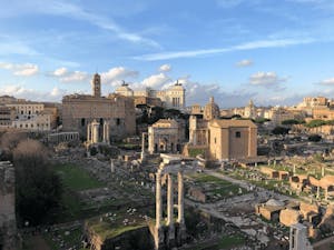 A panoramic view of the Roman Forum, showcasing ancient ruins