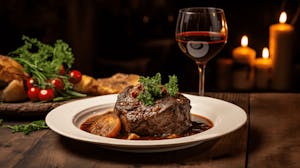 A plate of Osso Buco with a recommended wine pairing